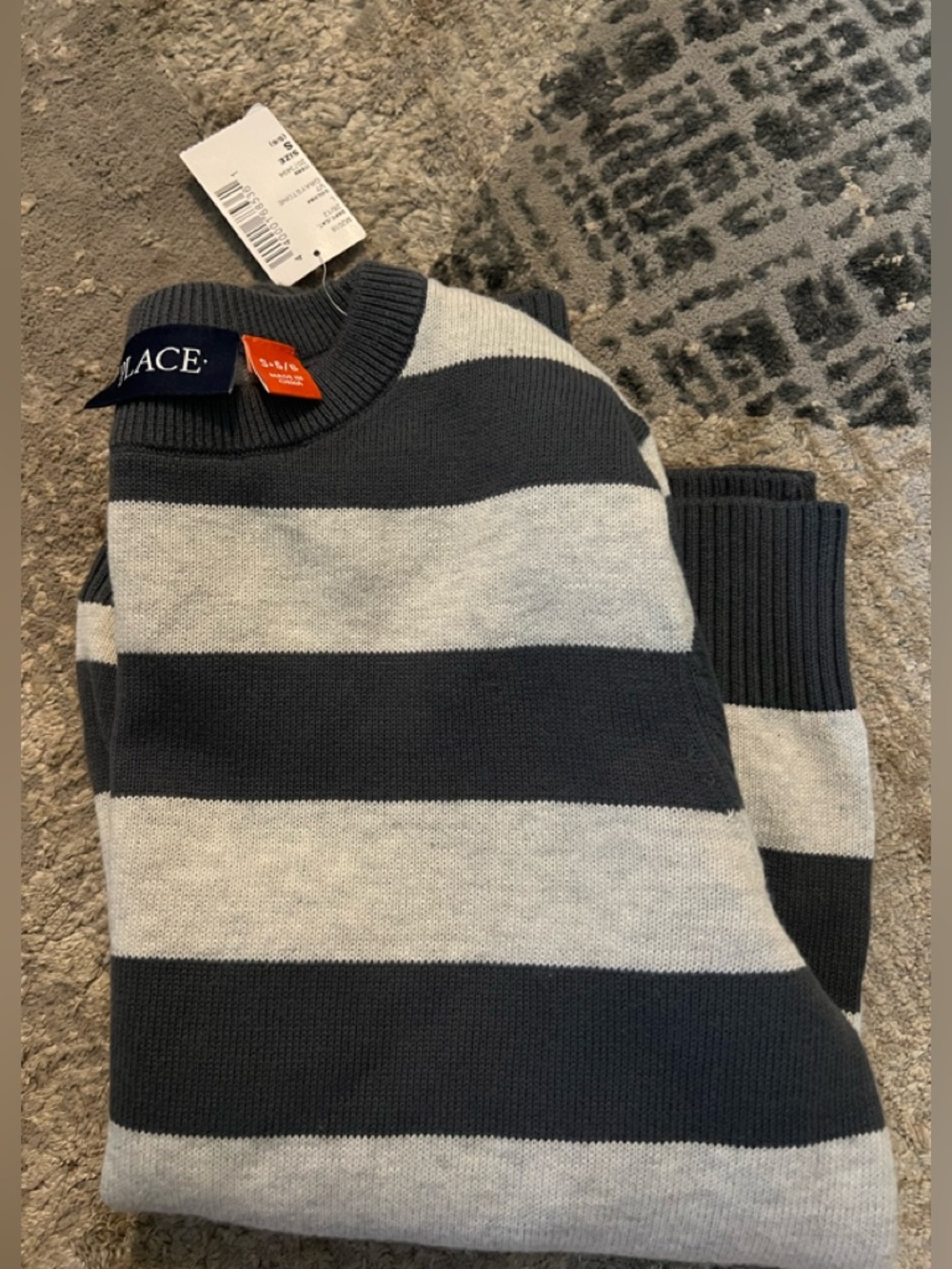 Sweater w/shades of gray. NWT. Classic colors. outgrown before able to be worn.